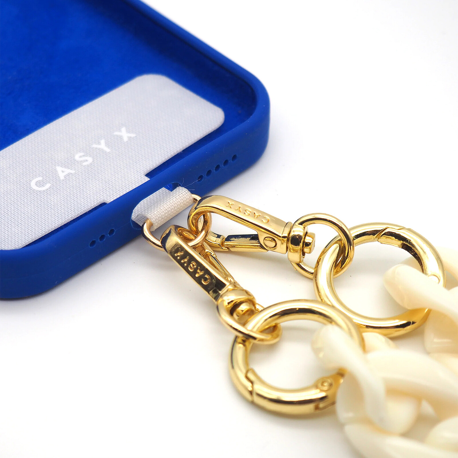 Cadena universal Casyx para teléfono, Marfil
